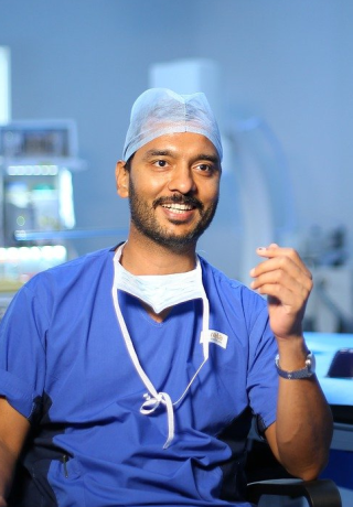 surgeon smiling in operating room
